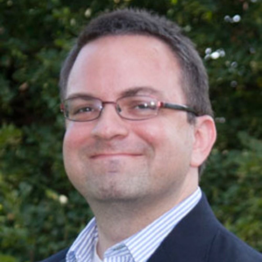 Dr. Chris Manion (he/him)