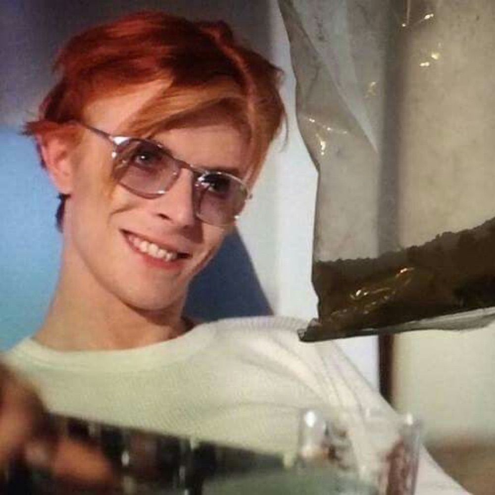 T.