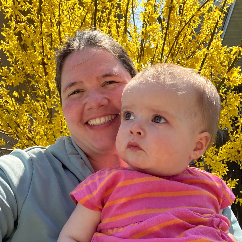 Katie DT (she/they/mama)