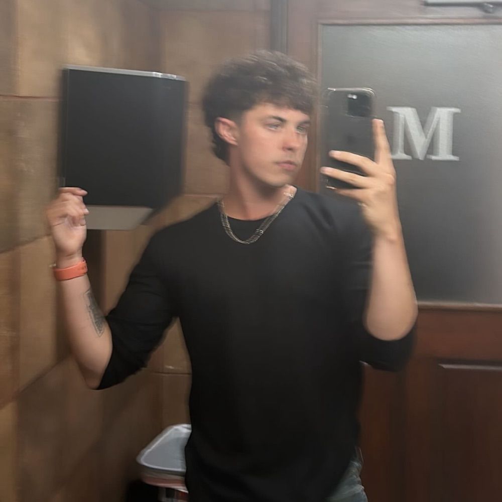 J T