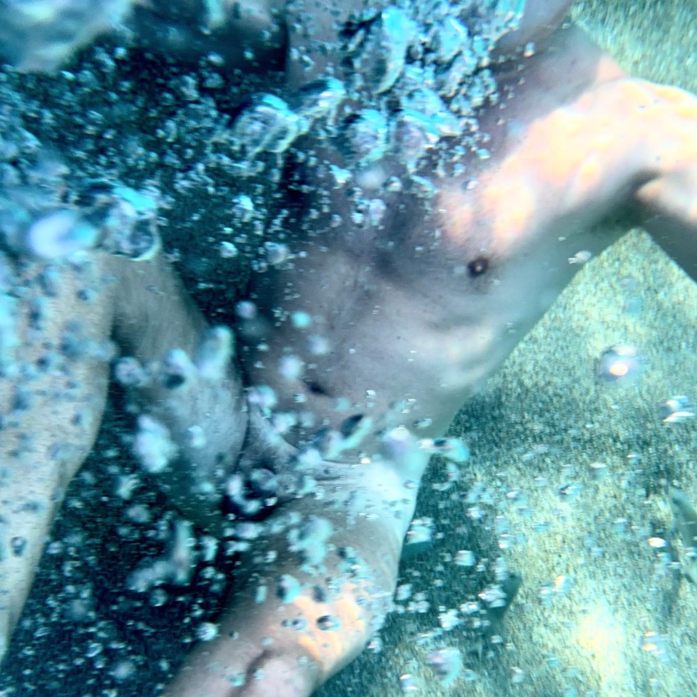 Naked guys swimming