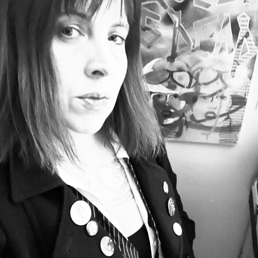 Jessie Lynn McMains (they/she)