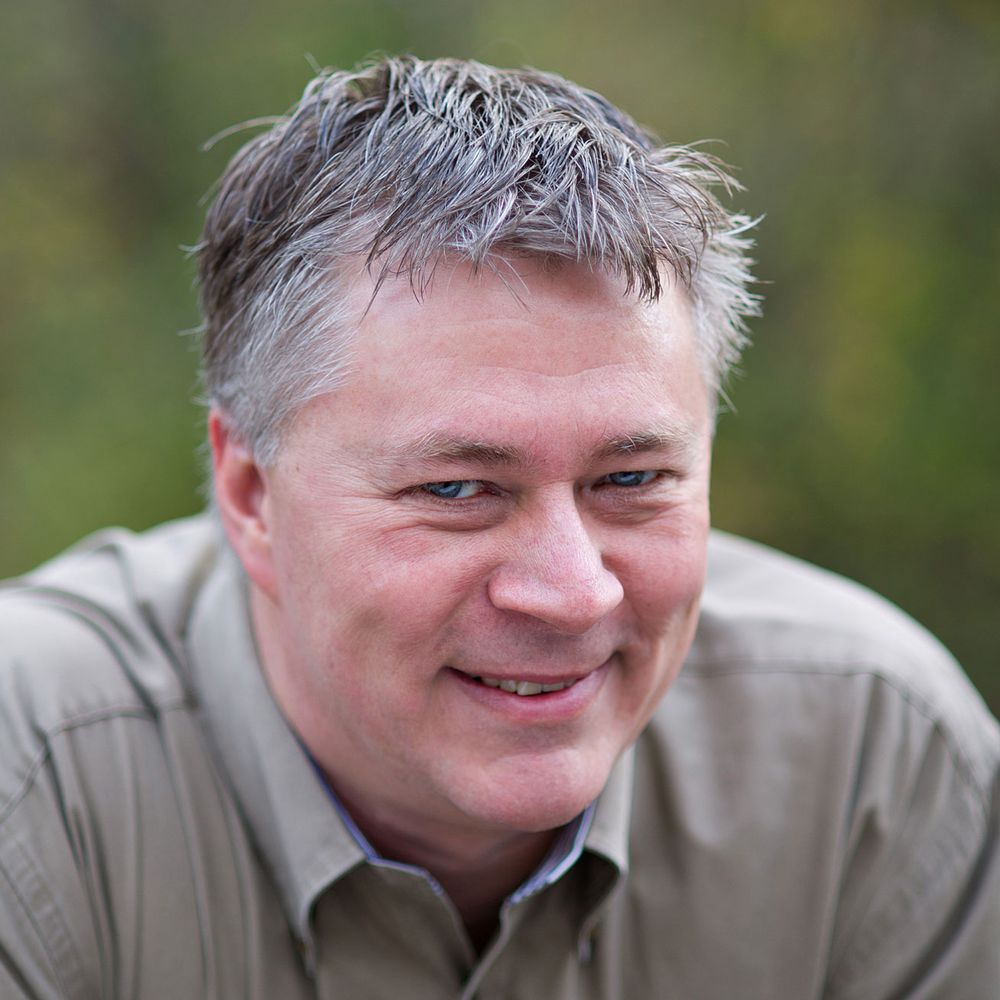 John P White