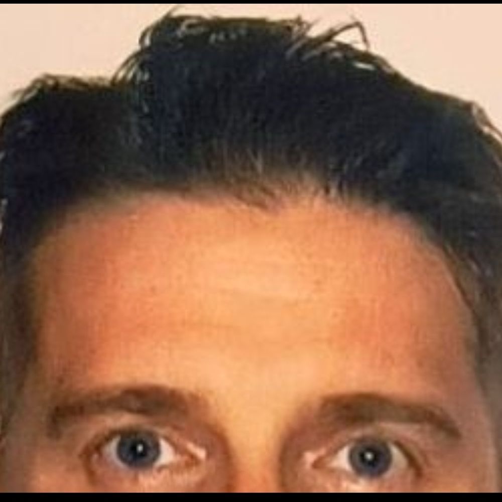 J.