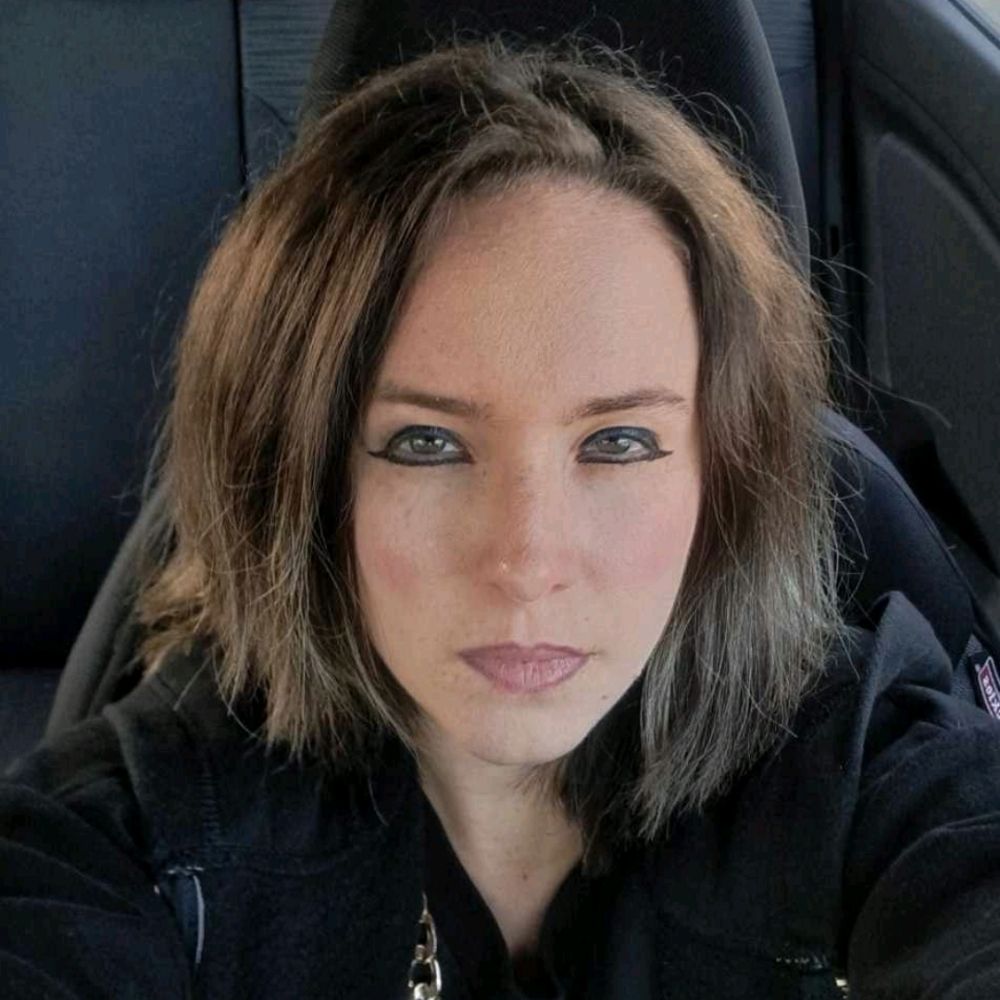 Author M. I. Verras (She/Her)