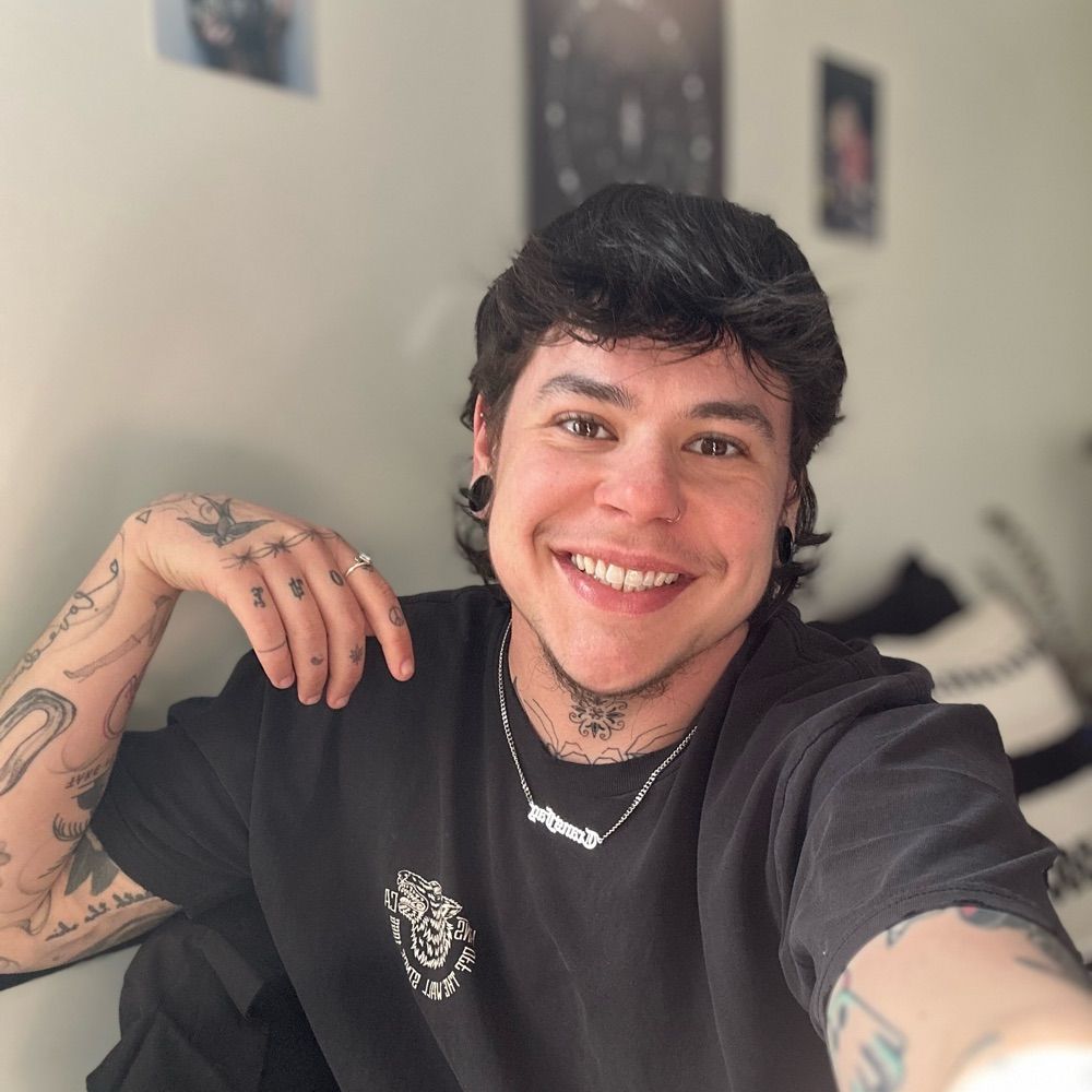 Em Hogan (they/them)