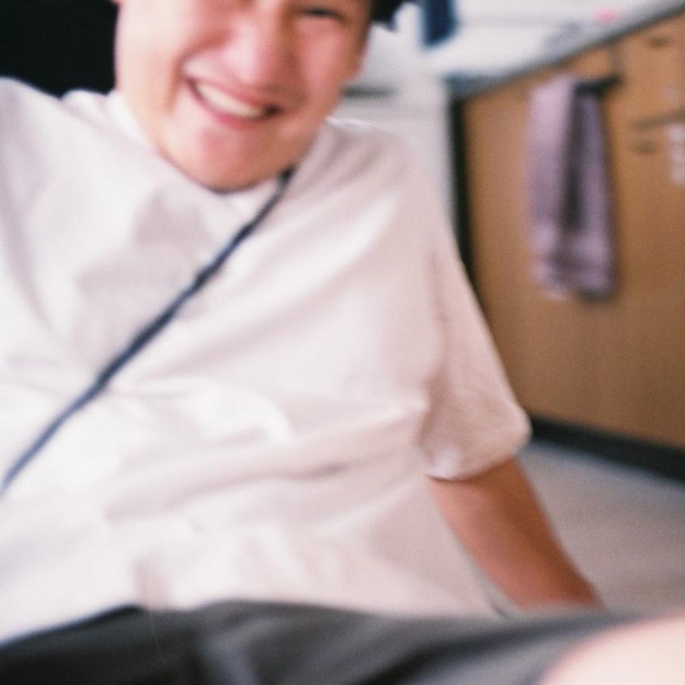 谷　龍介
