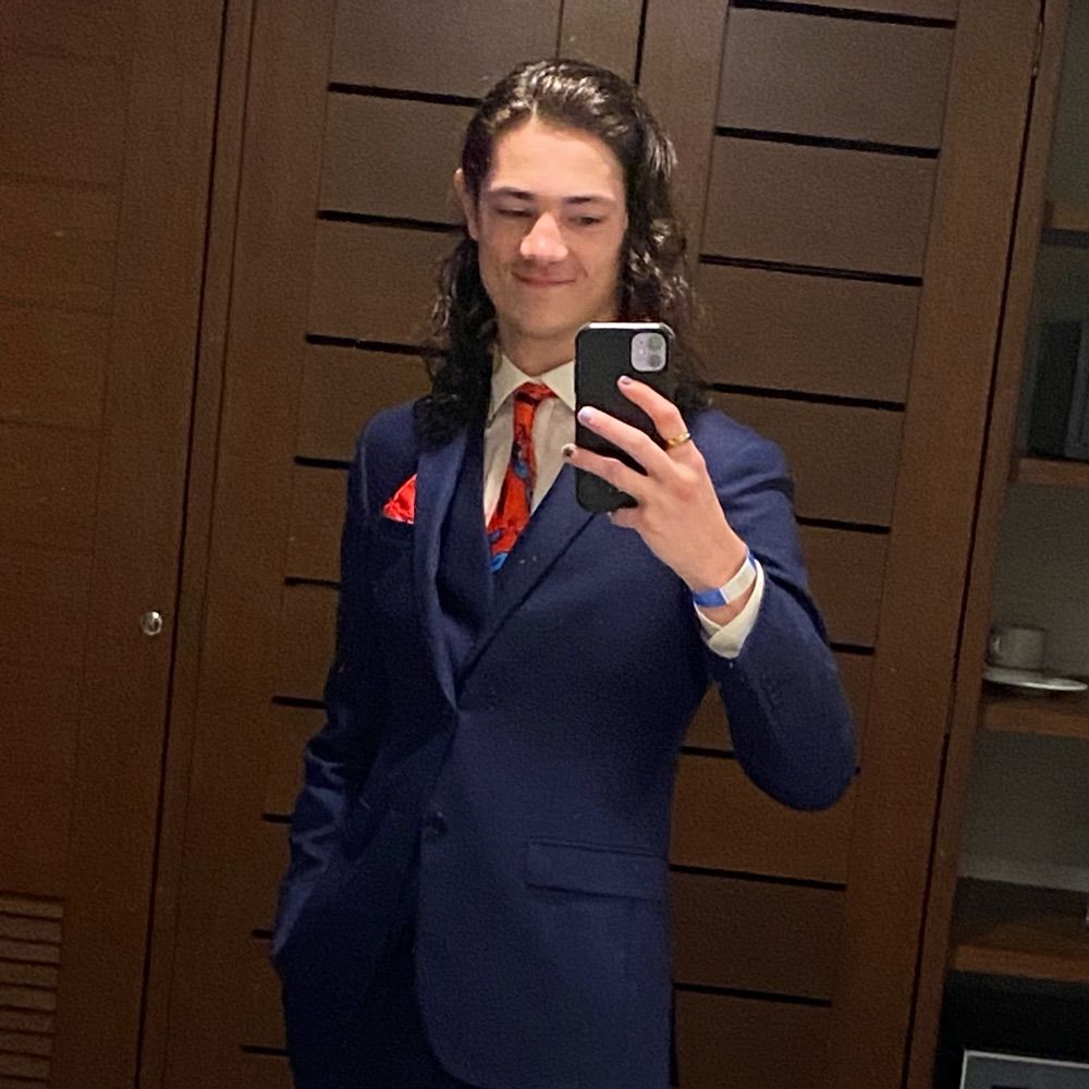 Tim (they/them)