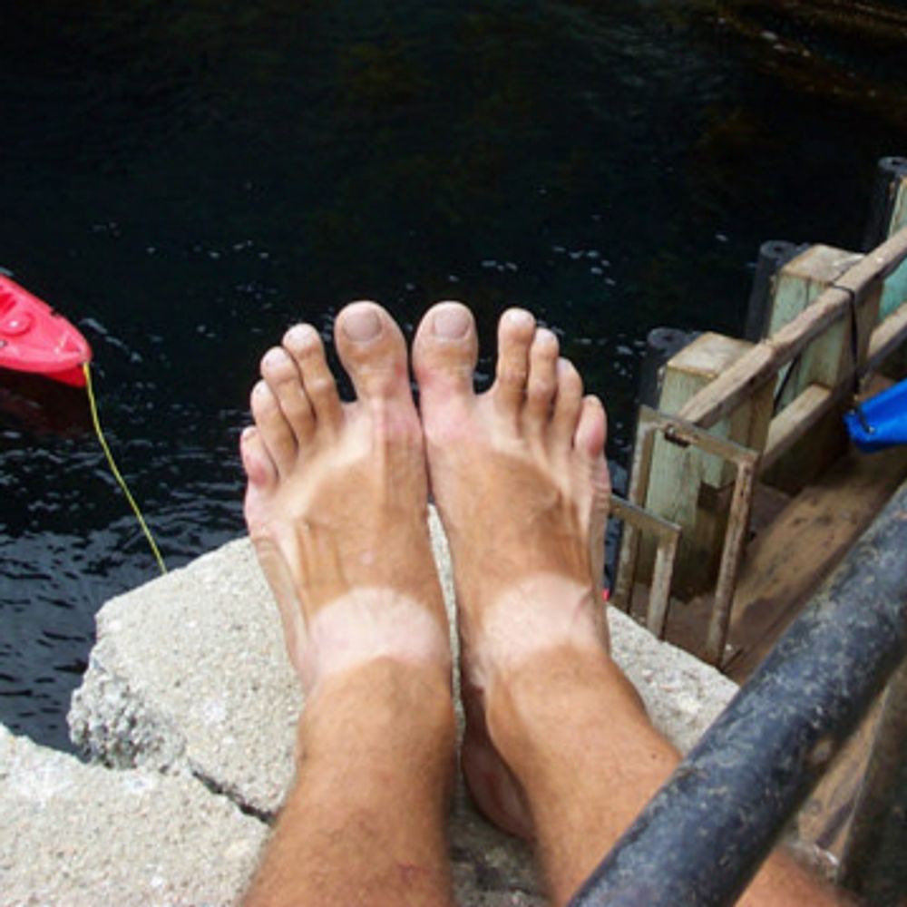 Barefoot Cave Kayaker