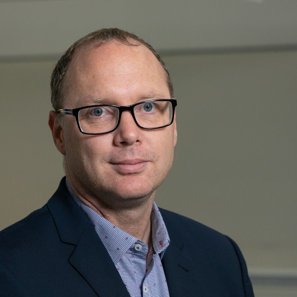 Prof Brett Mitchell