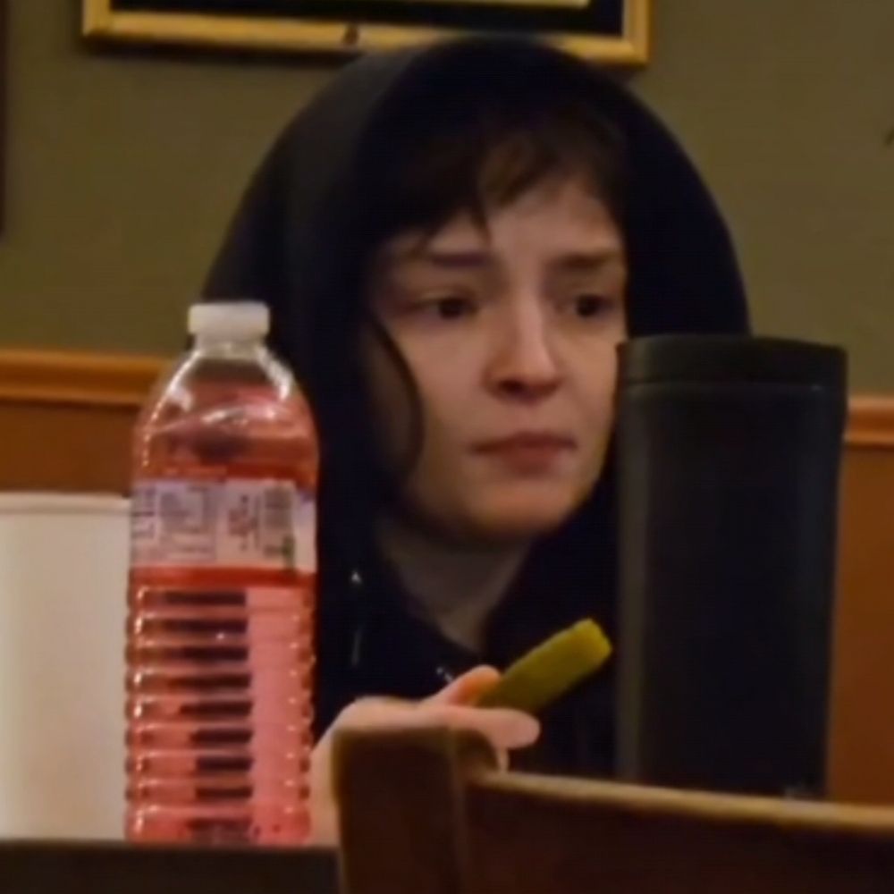 Lauren Mayberry crying and eating a pickle