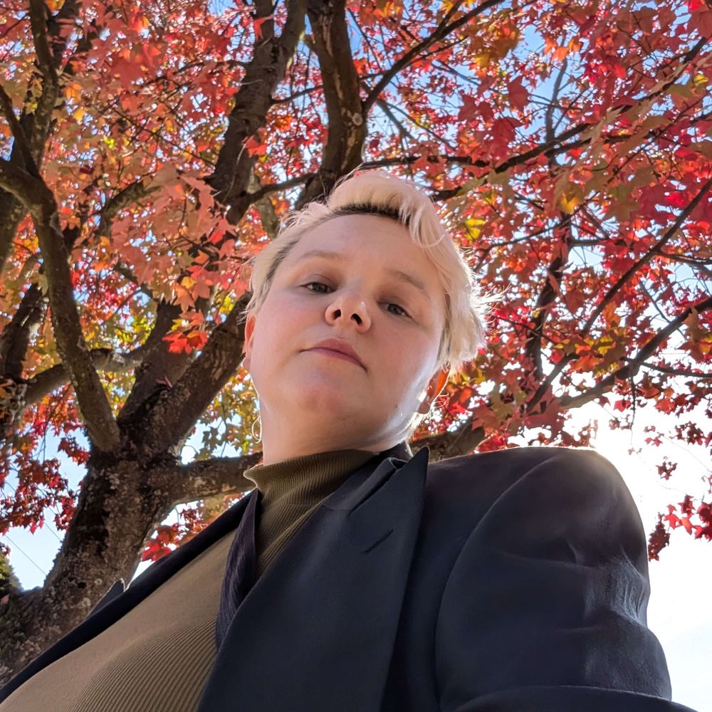Em Nimetz (they/them)