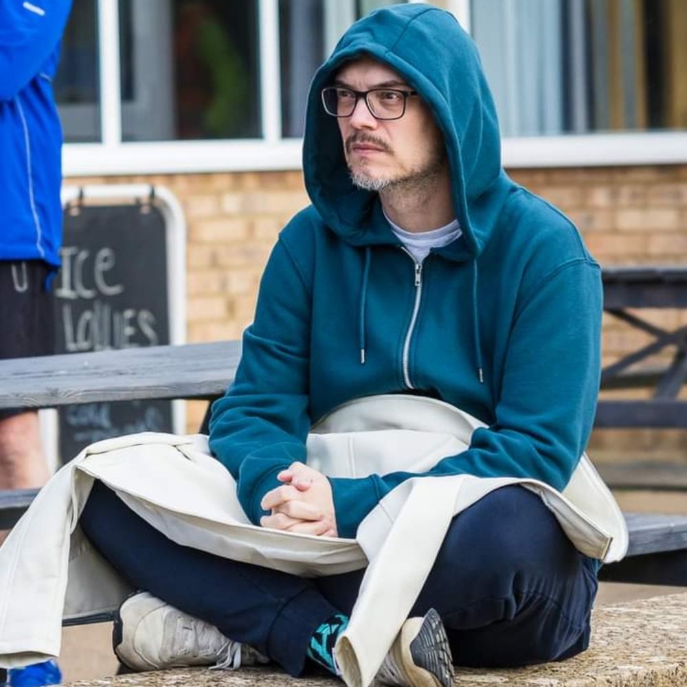 That bald bespectacled fella