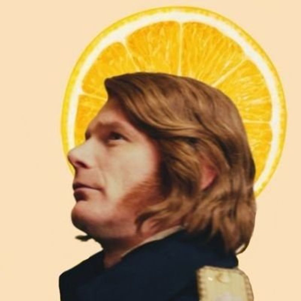 J.
