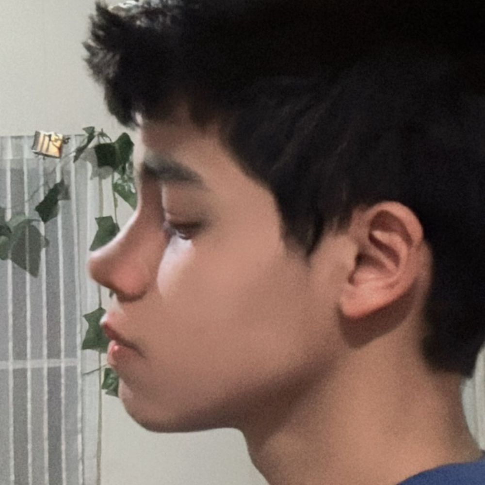 A boy with something is behind him