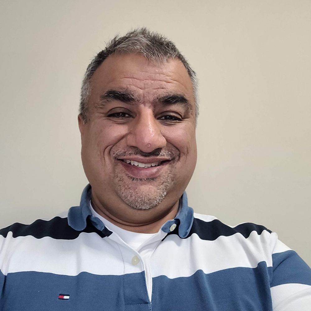 Azim Essaji (he/him)