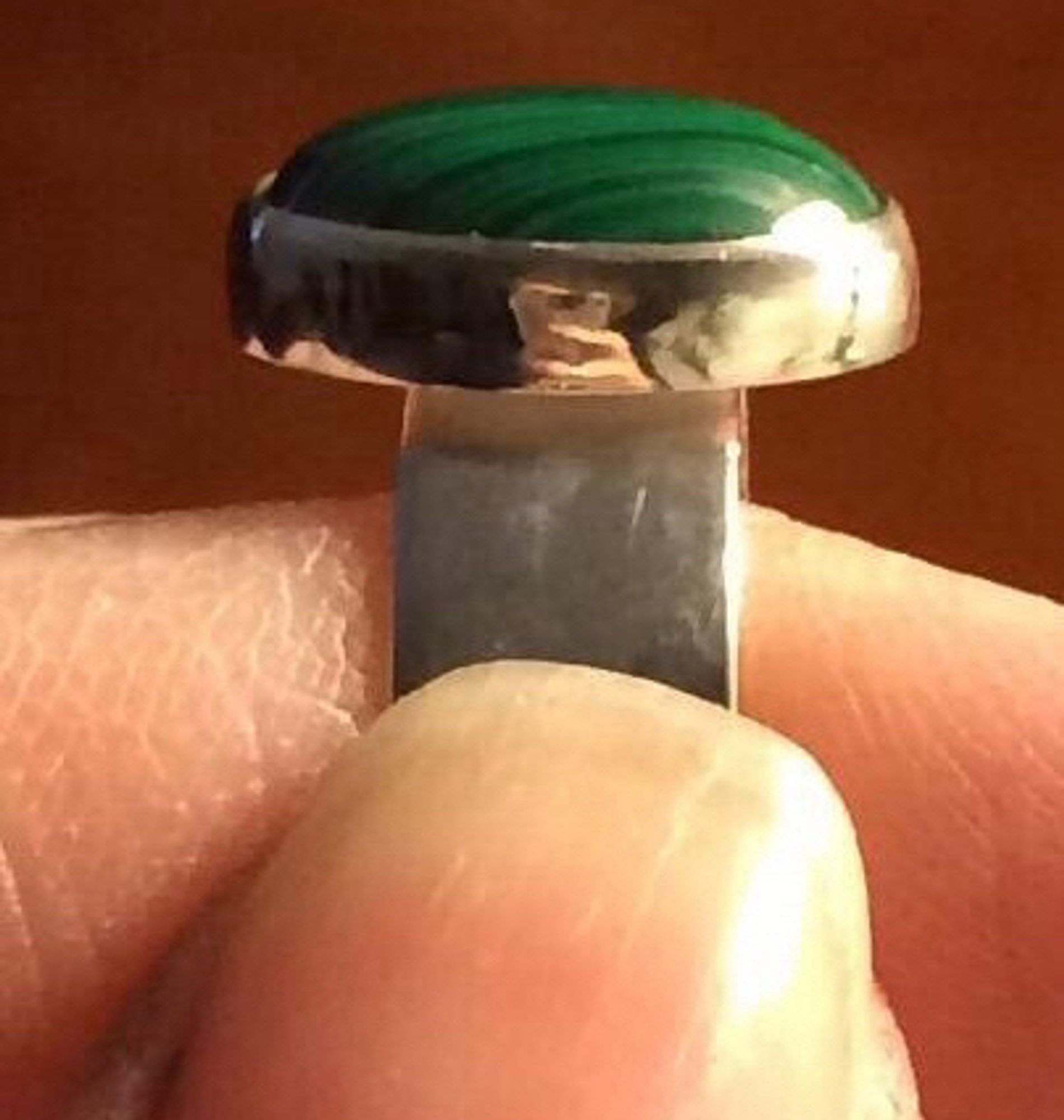 My first piece, a plain green malachite ring, with a plain wide band.