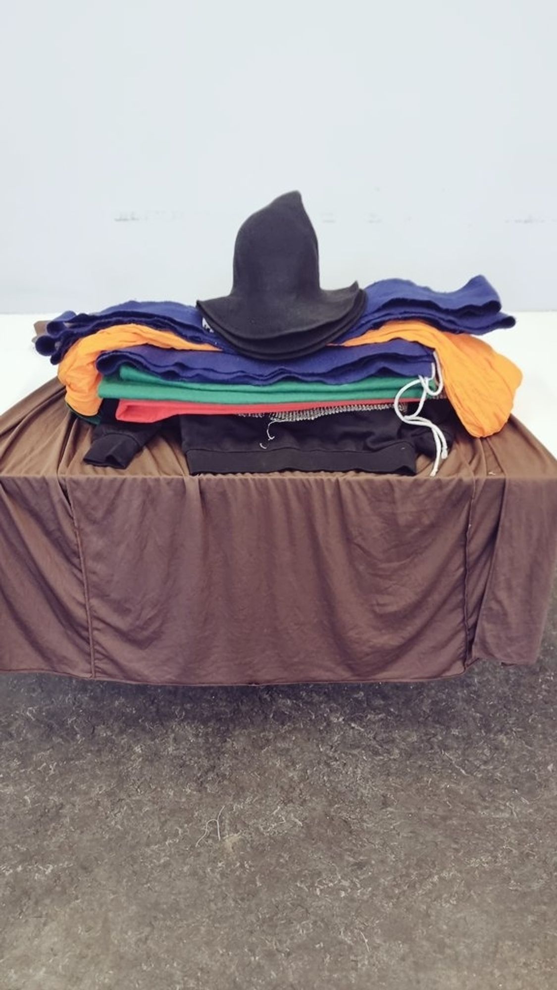 A table of costumes that'll be used for school children to play different MacBeth characters