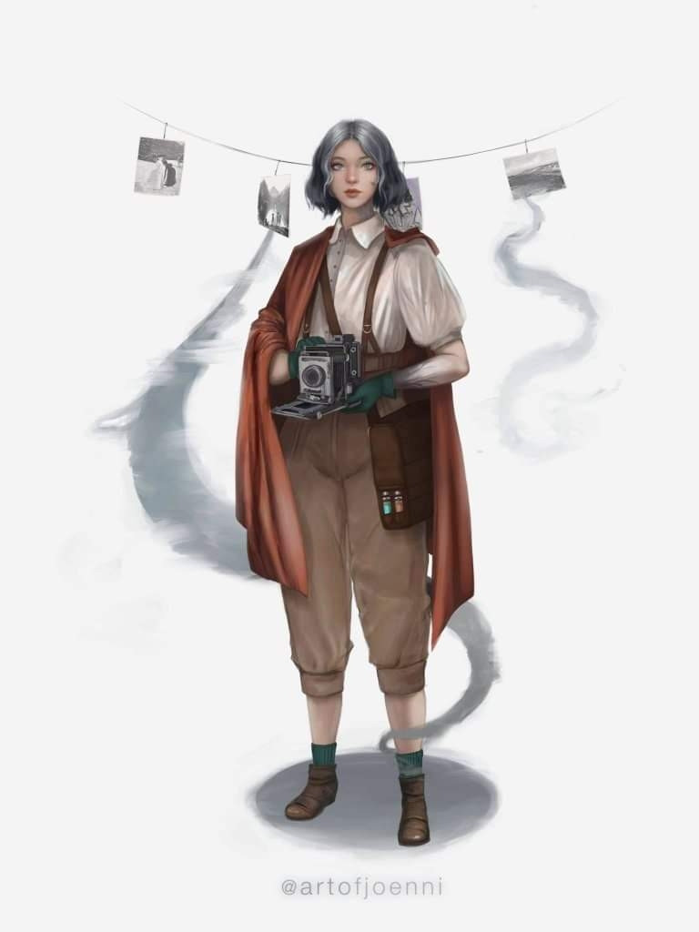 A young woman in a red cape, white blouse, suspenders, and rolled up tan pants holds an old camera. She has photos hanging on a line that have incorporeal mist streaming from them. 