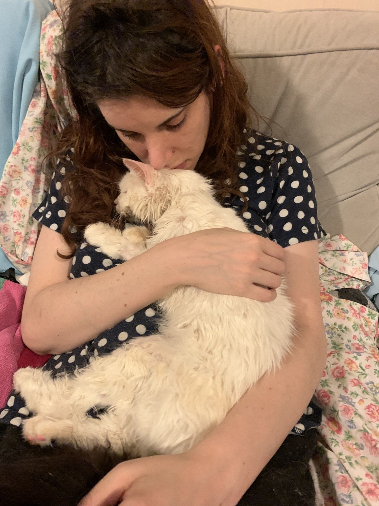 a picture of claire holding gately in her lap and holding her face against gately's. this picture was taken a few days before she died and she was terribly skinny but still held onto me and took so much comfort in knowing i was with her