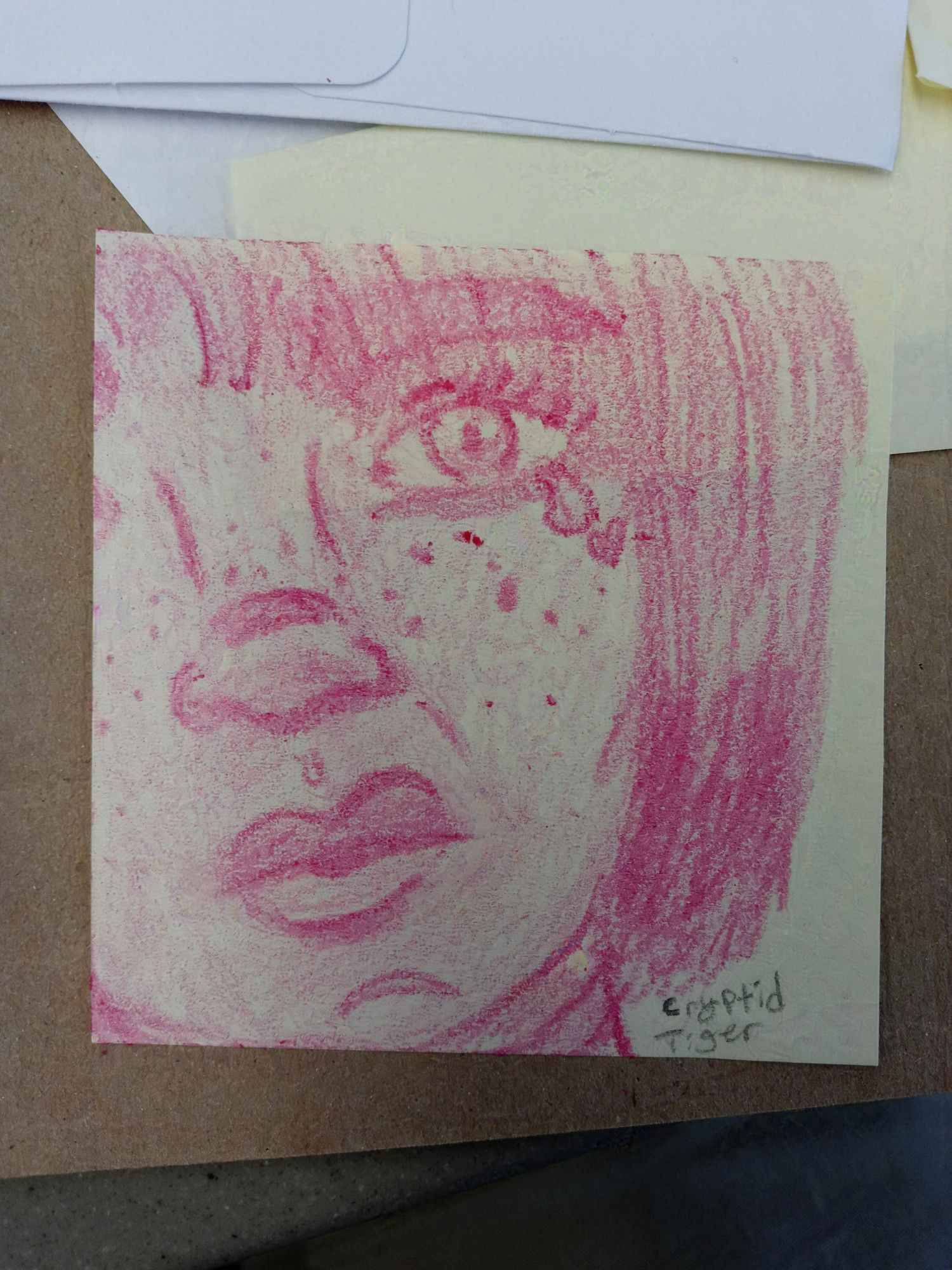 A traditional sketch done in pink crayon of Cryptid's OC Cerise. She is drawn in a realistic style that focuses on creating values with the crayon. Because she was drawn on a sticky note, her face is cropped. The left side of her face (viewer's right) is shown, with the rest being cut off and the image also cutting off around her chin and above her eyebrows. Her expression has her face scrunched up in horror as a single tear begins to fall from her eye.