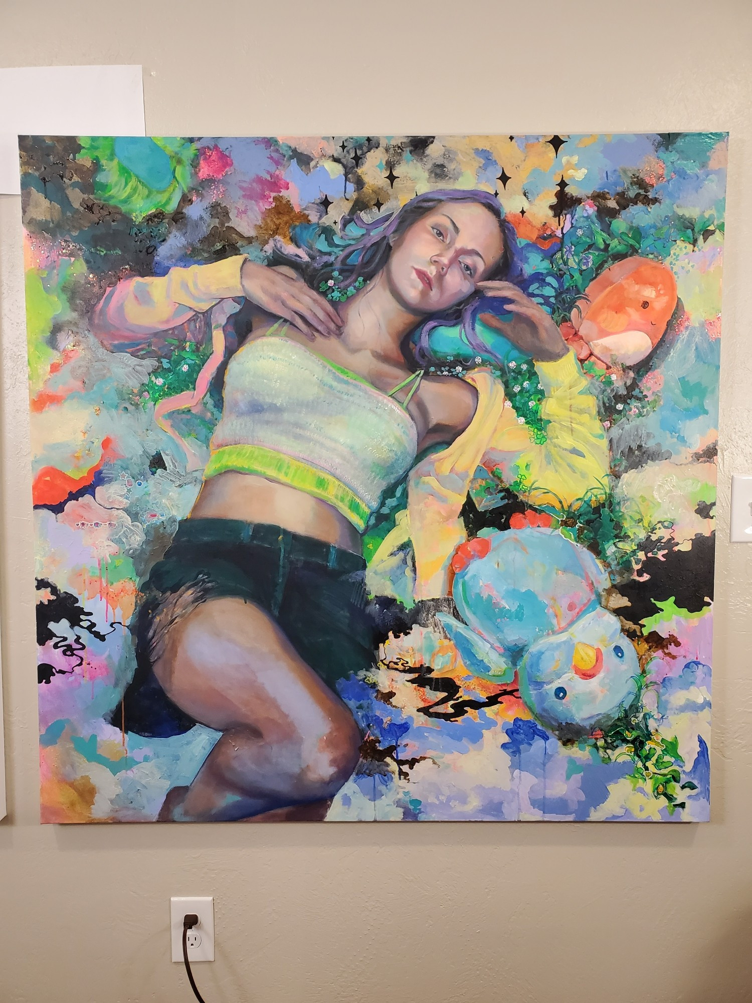 Photo of the same painting with some changes made to it: the figure now has lilac hair, and there are more light, subdued tones in the background.