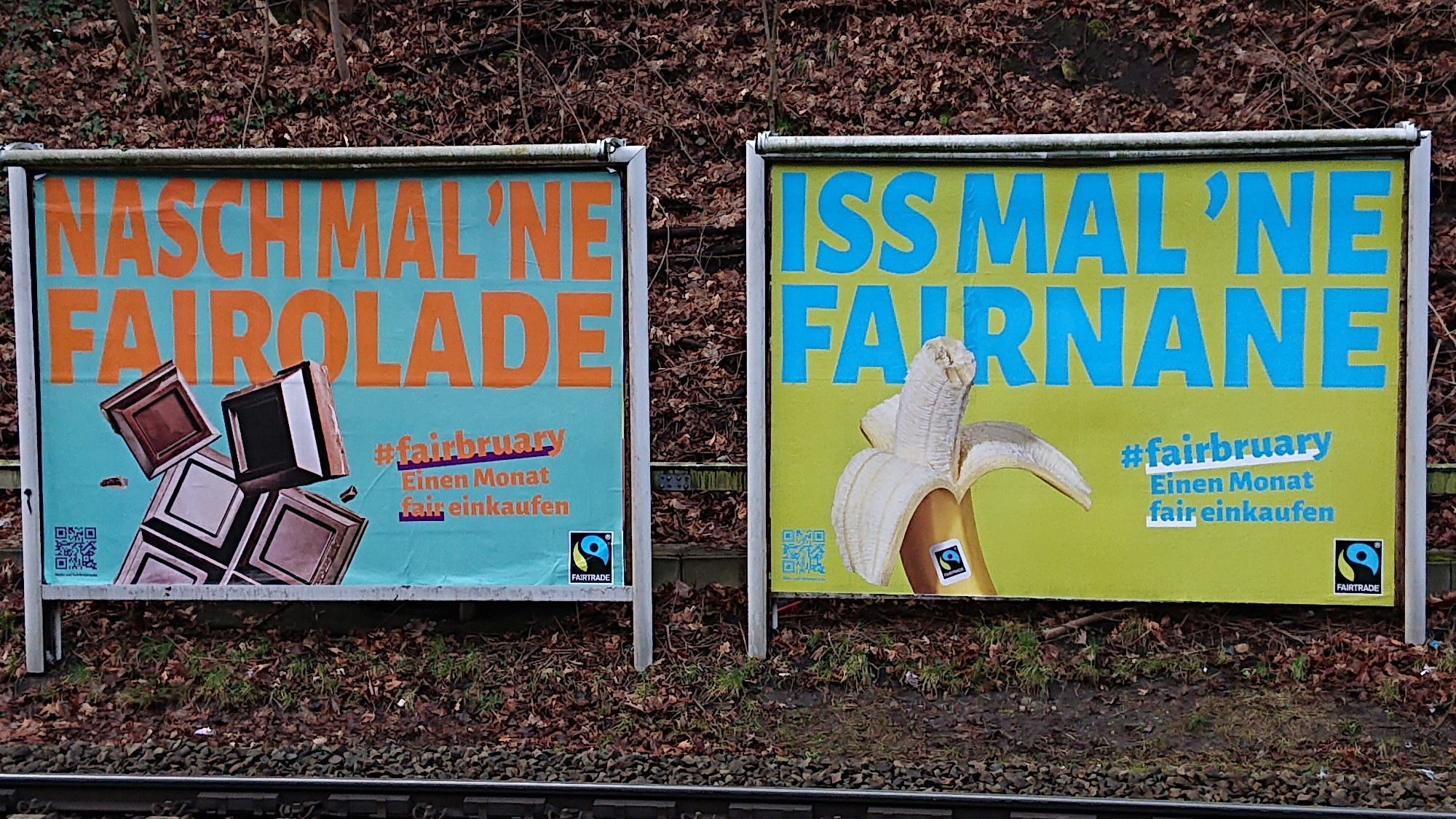 Photo of two other poster ads from the same campaign. The one on the left encourages the reader to "snack a fairolate" and features an image of some chocolate. The one on the right wants us to "eat a fairana" and features a photo of a banana.