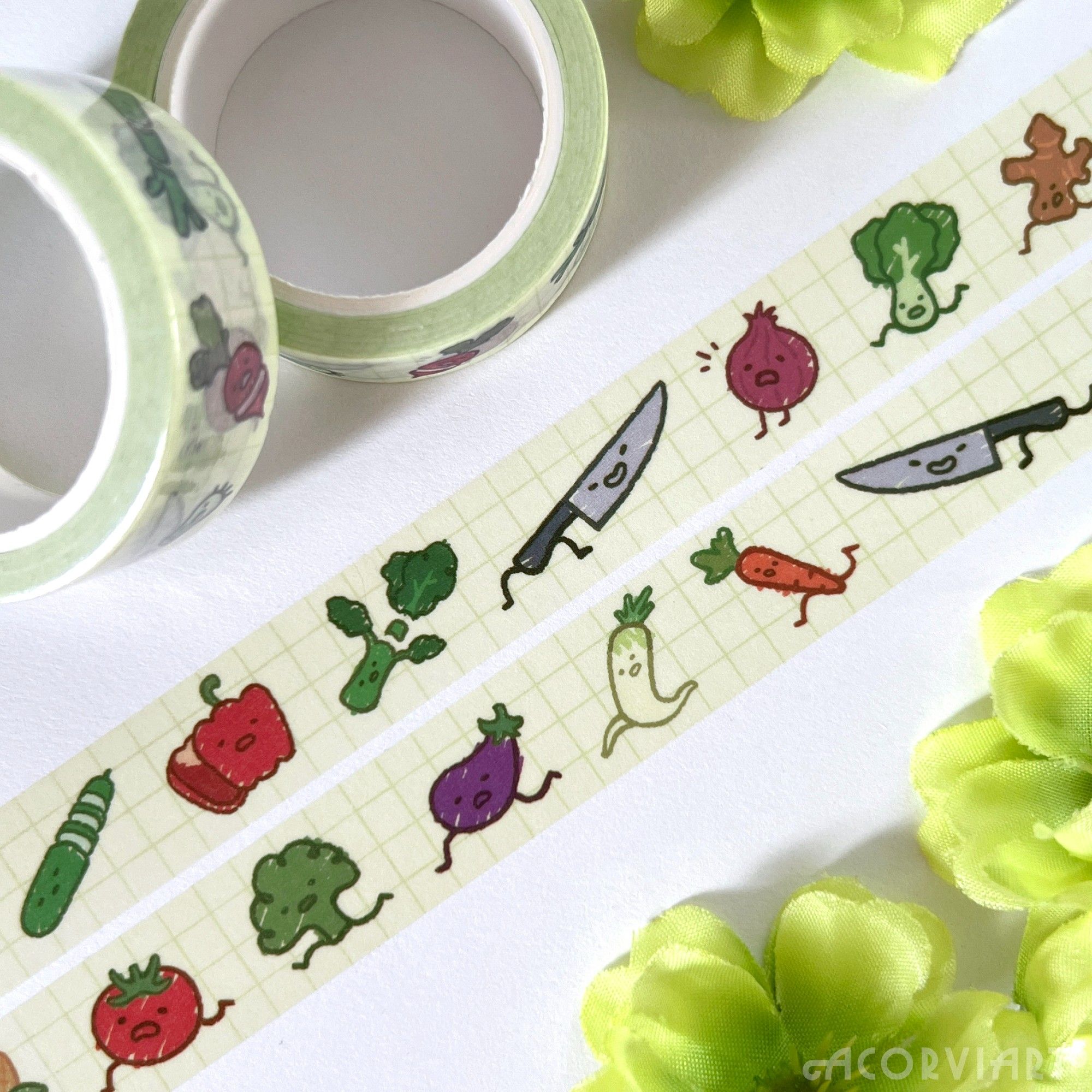 washi tape of vegetables running away from a knife that's chasing them to chop them up. some of the vegetables have already been chopped up. all of them have little faces on them.