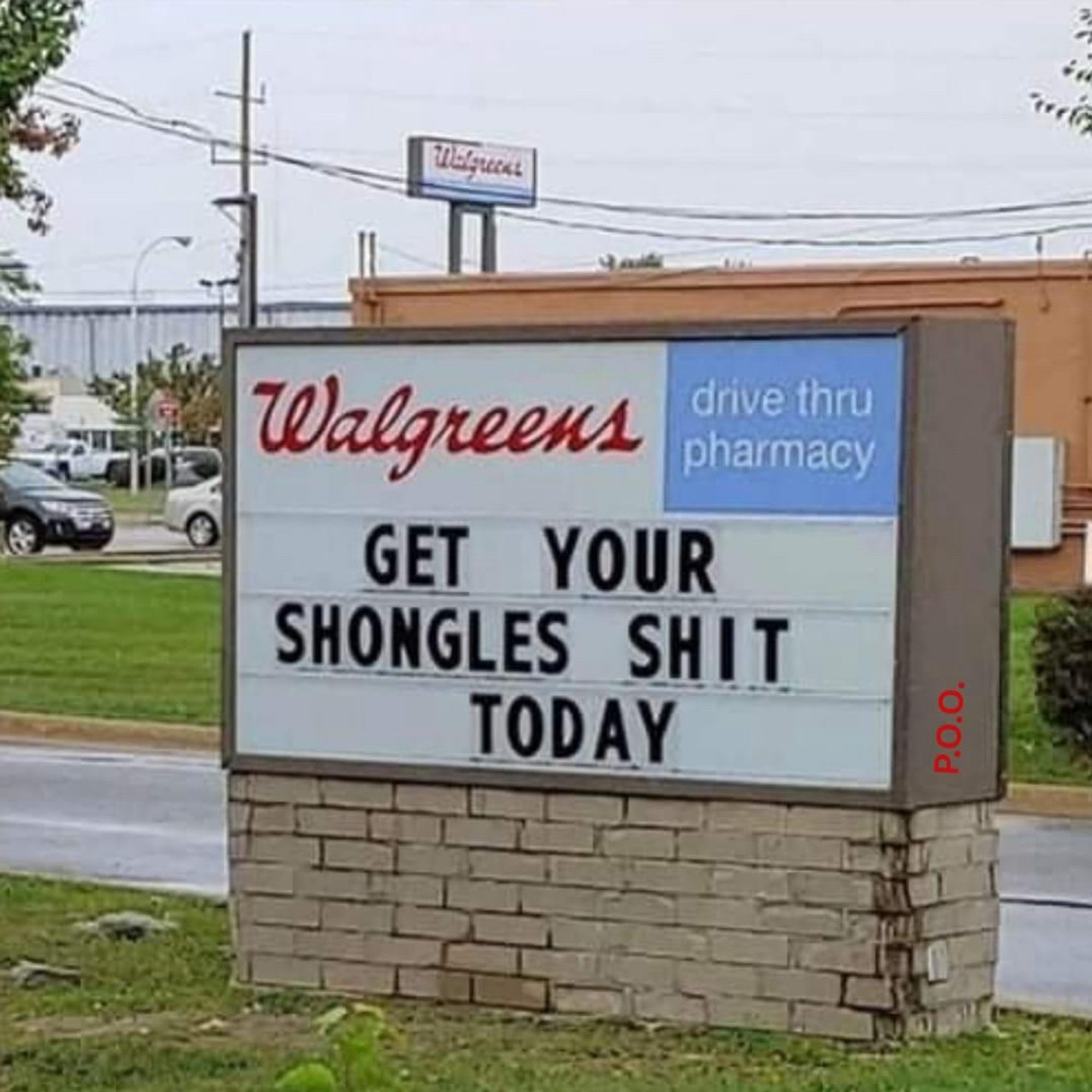 A Walgreens sign reads: “ get your shongles shit today”