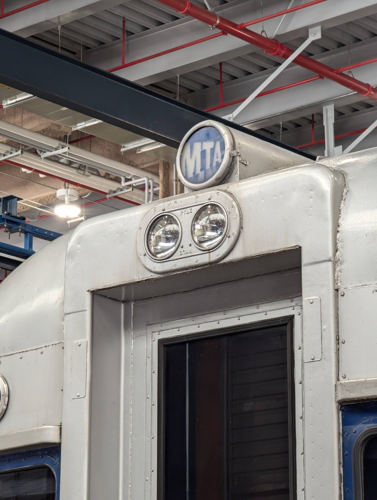 Close-up detail of the MN1 Inspection car, with a tiny MTA logo above the lights and door.