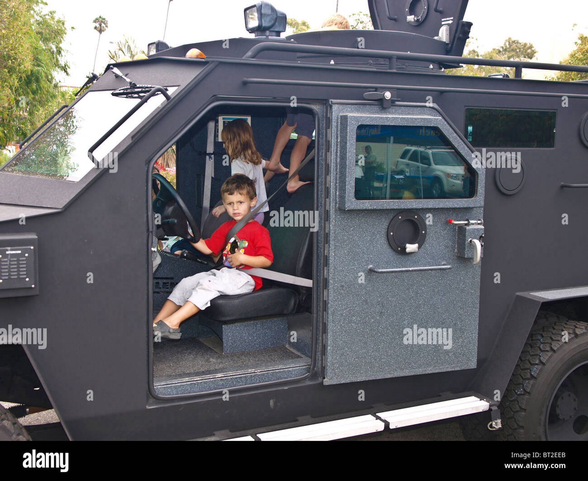 Children playing in armored vehicle