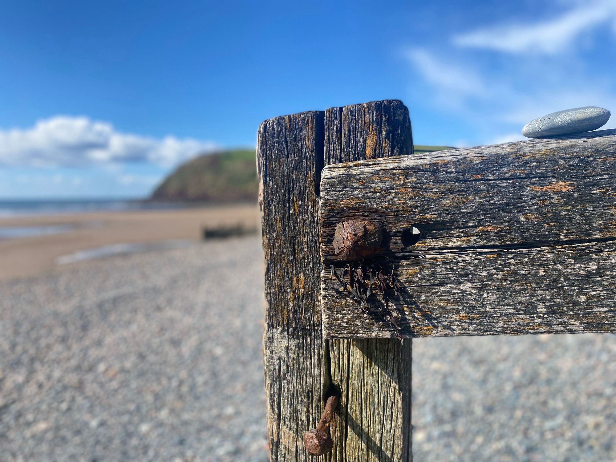 A view across an old wooden groyne