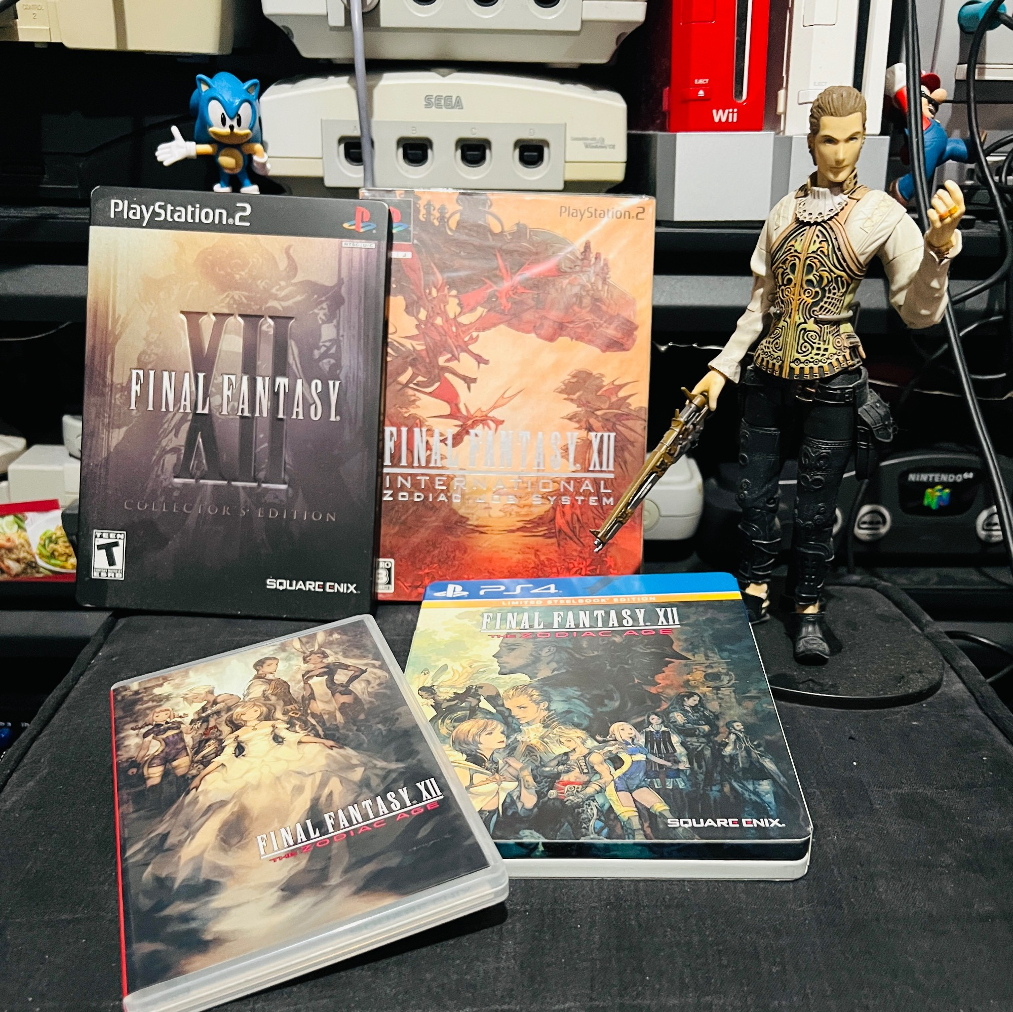 4 copies of Final Fantasy 12 -- the steelbook North American edition, the Japanese release of The International Zodiac Job System version, and the Switch and PS4 ports.