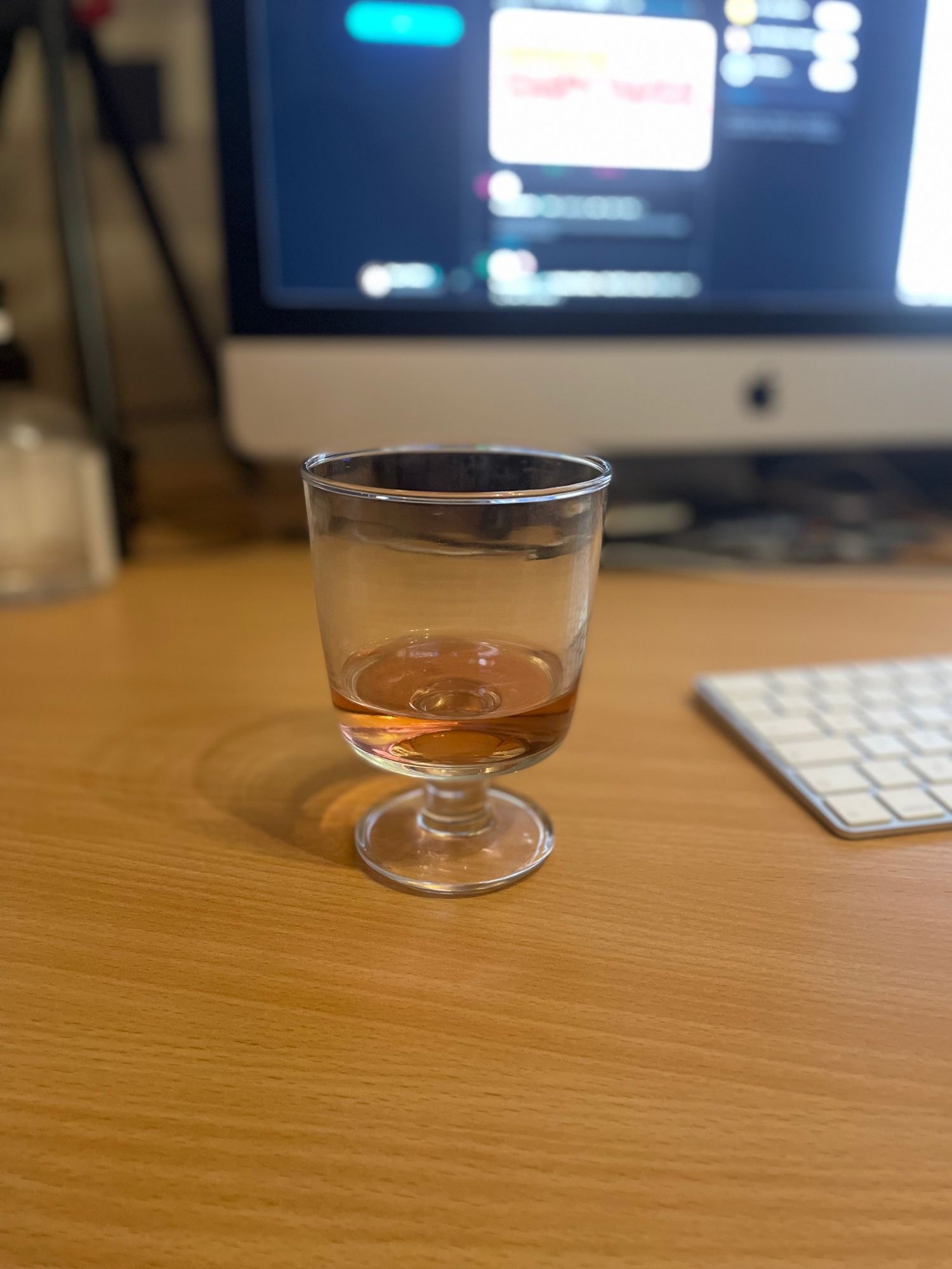 Glass of rose wine on desk