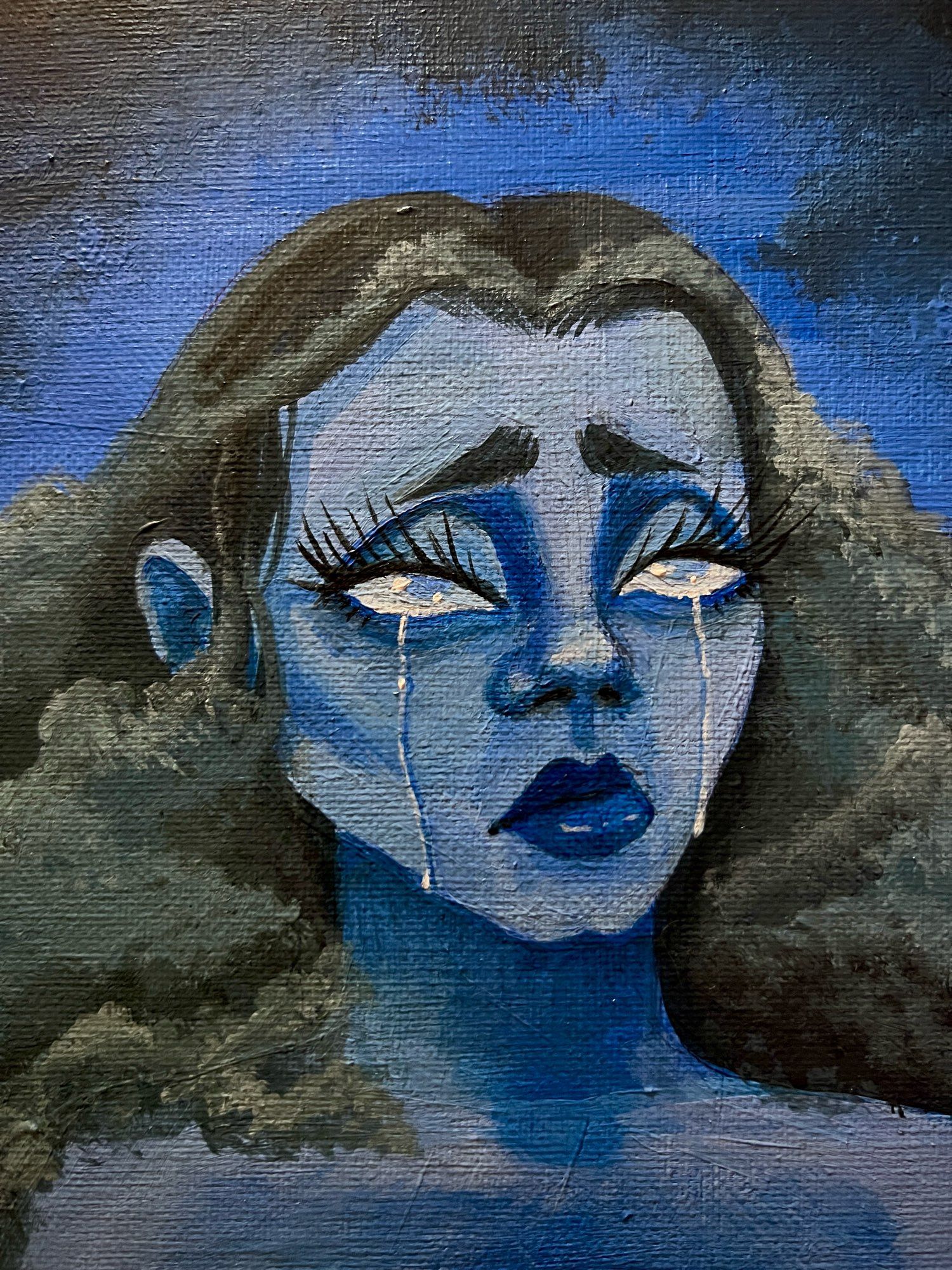 Acrylic Painting by ZoeTreez 

Close up crop of the face. 

A mostly blue acrylic painting on a canvas. The painting is of a blue femme character. The blue femme character has a long, wispy eyelashes and heavy eyes. The figures hair is stormy and textured like the clouds in the background. Her eyes resemble raindrops within the clouds. Her expression is of a pouted lip and raised brows.