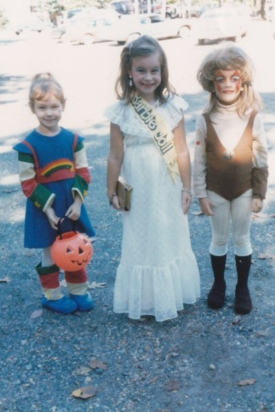 Three little girls dressed for Halloween in 1984. From left to right: Rainbow Bright, Barbie, Cheetara.