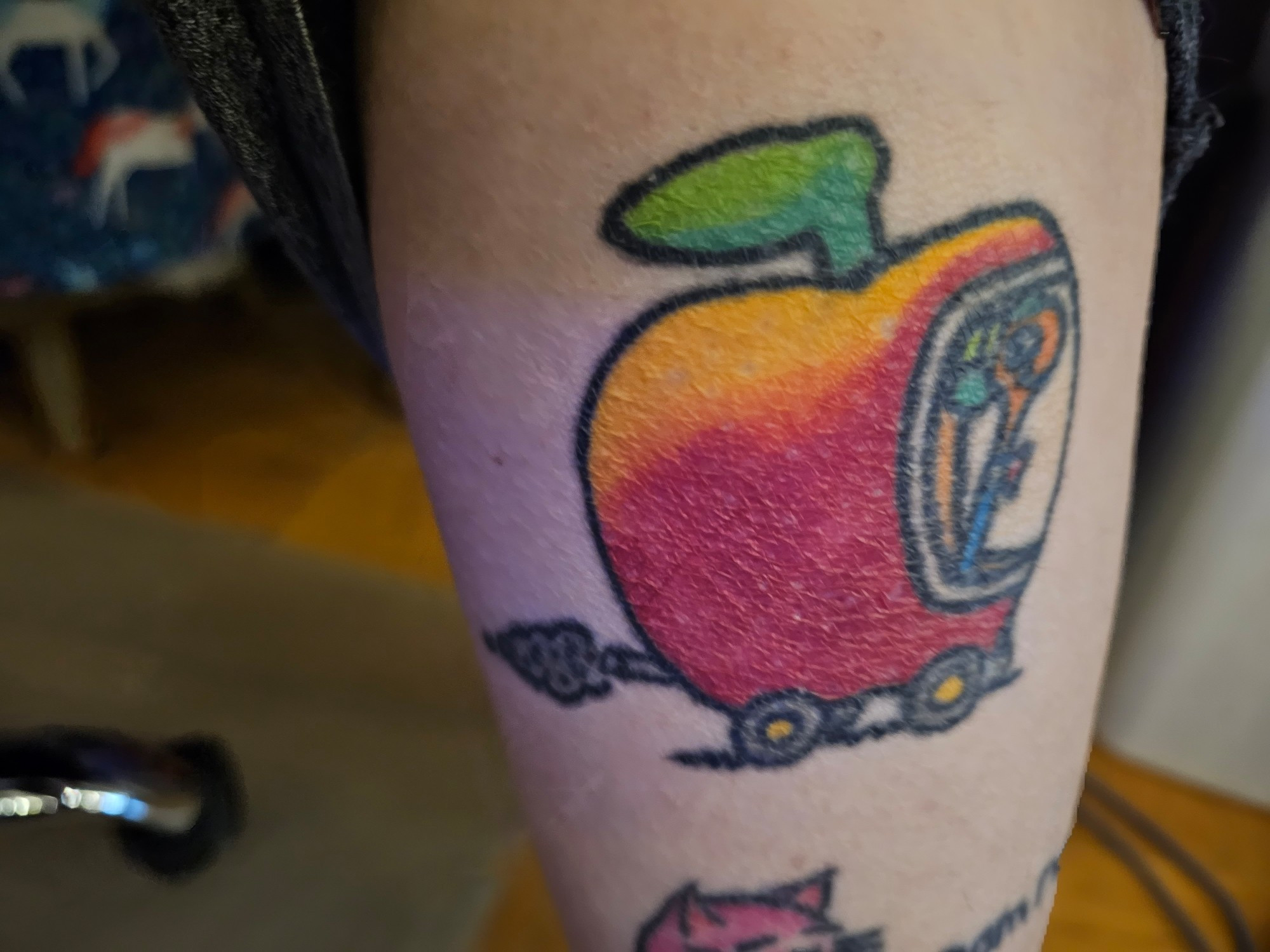 Tattoo of lowly the worm in his apple car