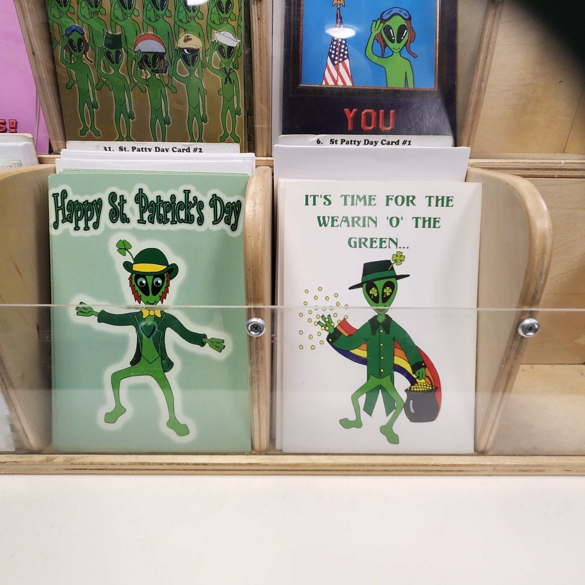 Two greeting cards that are st. Patrick themed with aliens. Crazy!