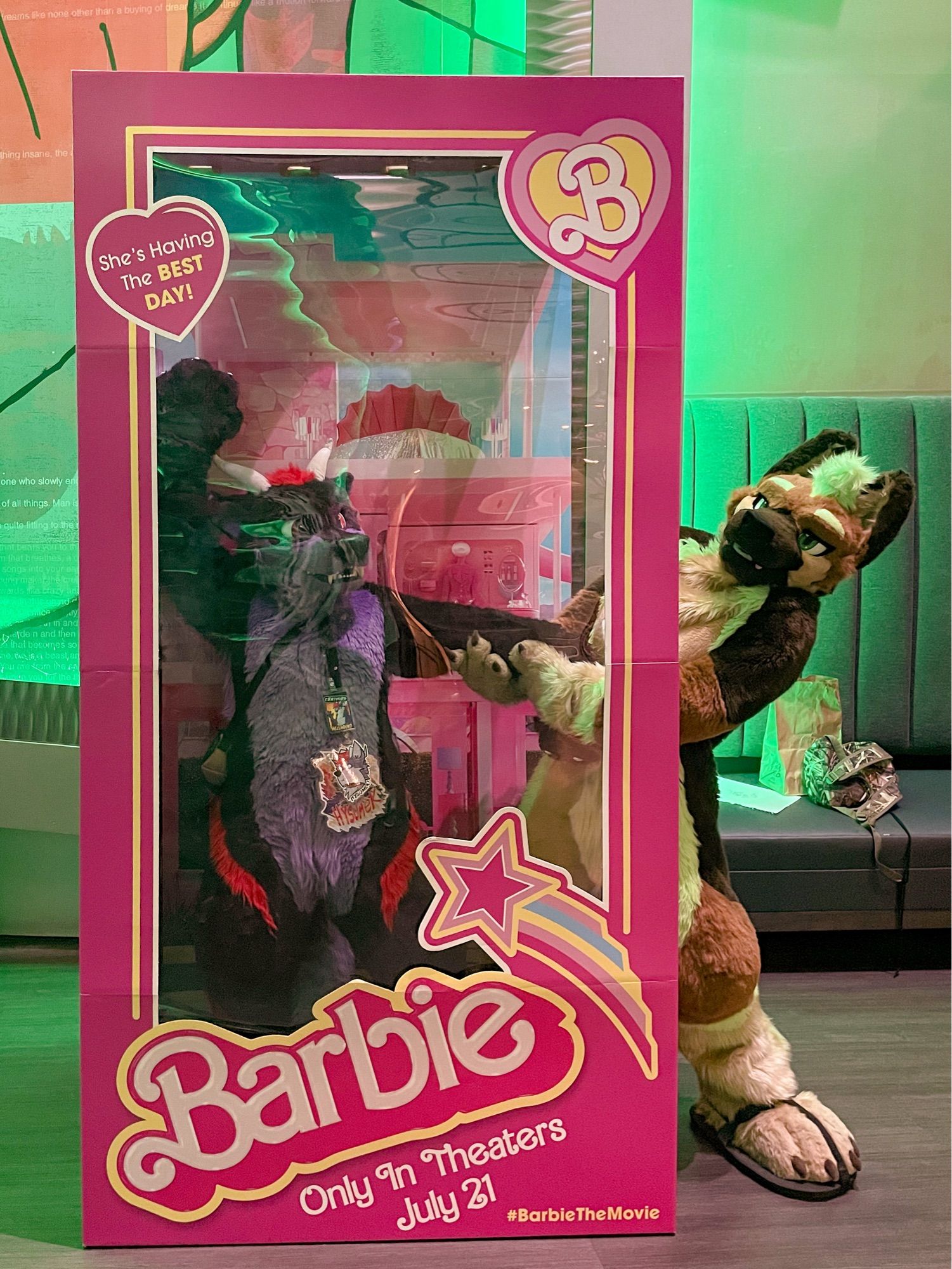 Sequoia Shep pulls Hysumek out of a movie theater promo Barbie box photobooth