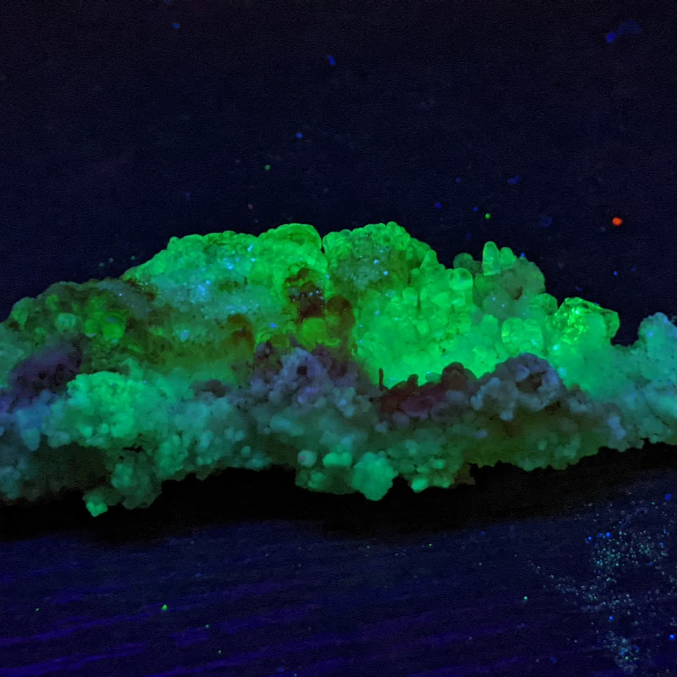 hyalite opal glowing green