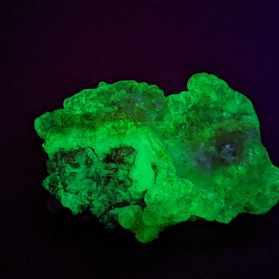 hyalite opal glowing green