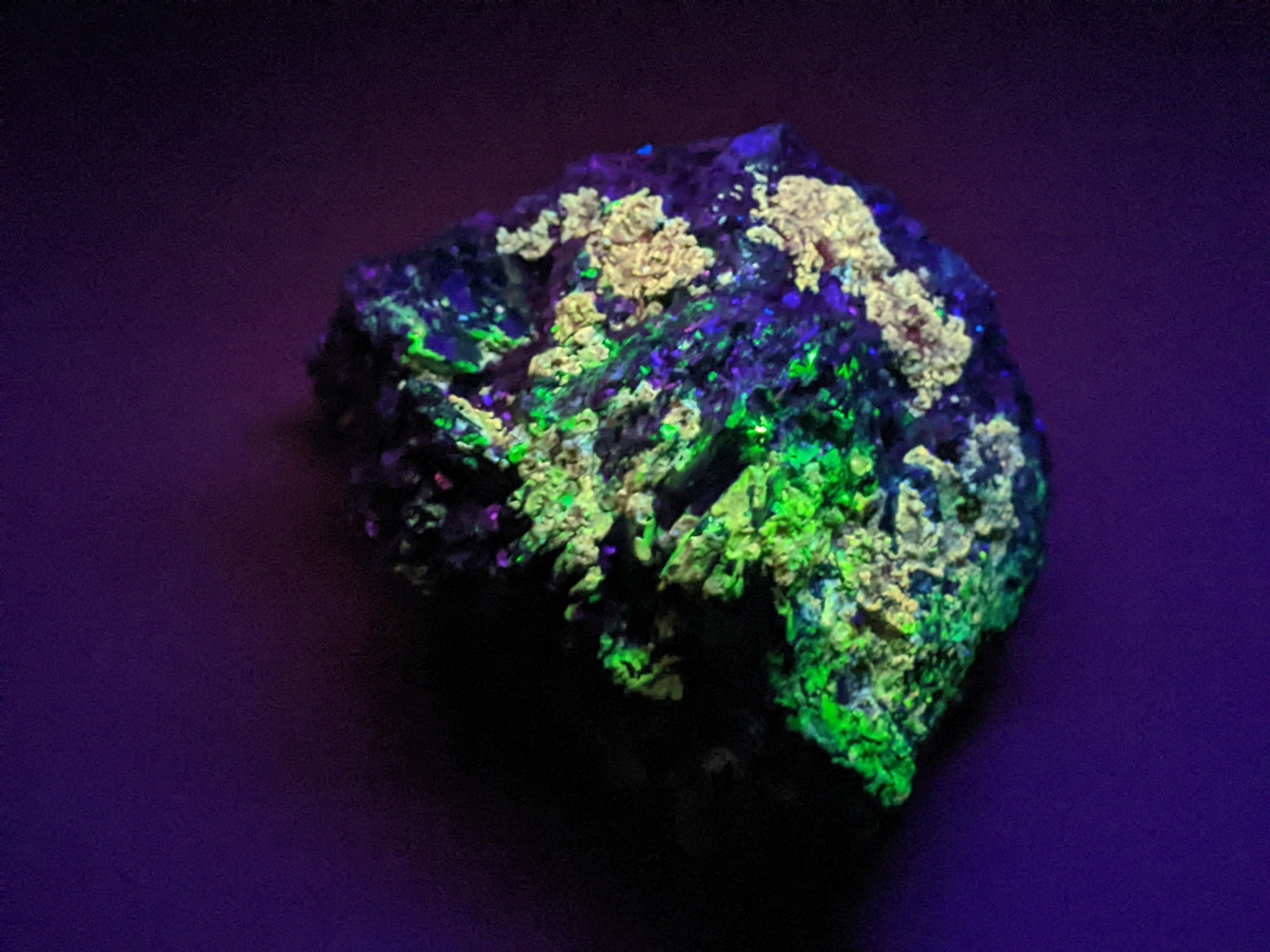 Hematite with some glowy green and orange stuff, not sure what that is