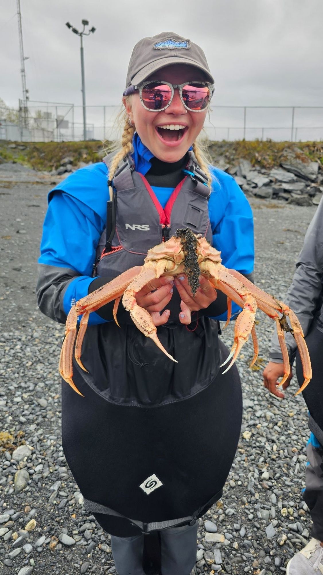 Hannah Bogdan shows off a crab she found on the beach in Valdez.