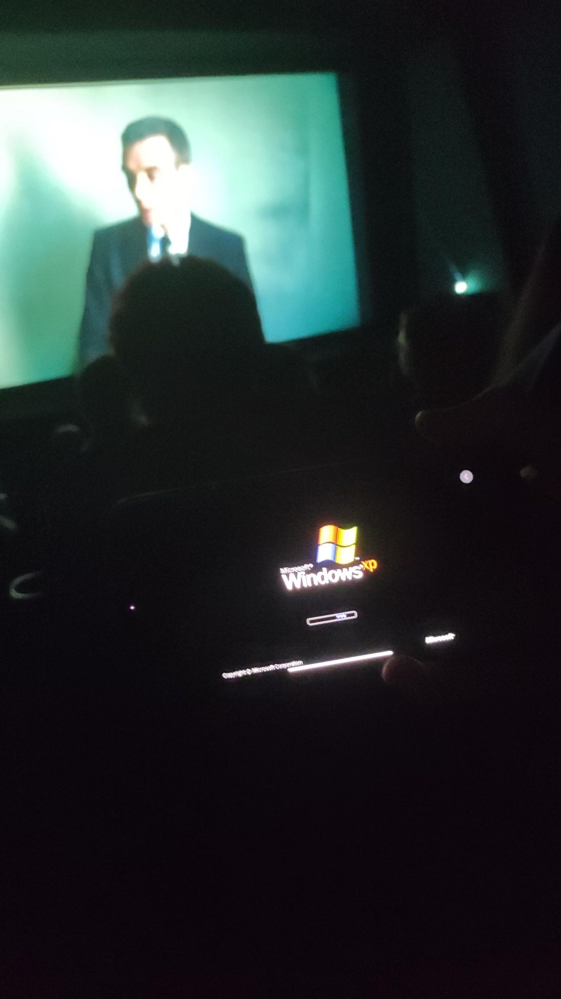 picture of me booting windows xp on my iphone while in the cinema watching the movie oppenheimer