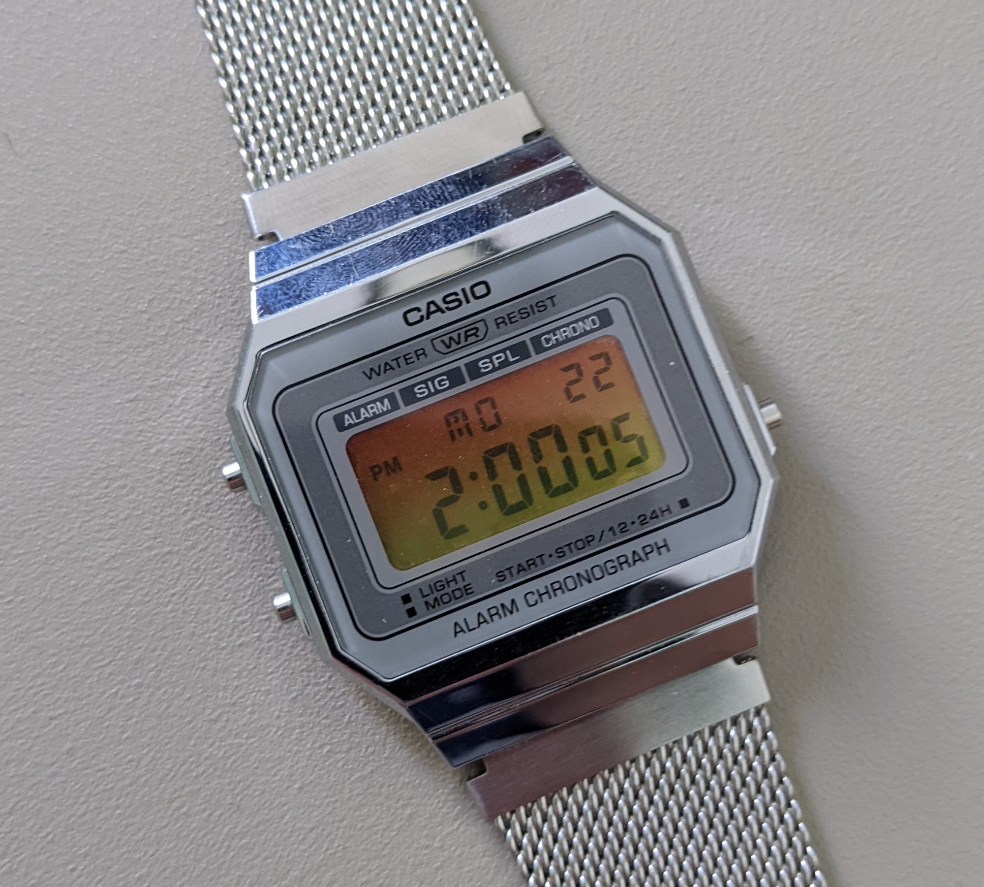 the reassembled watch with a yellow-orange display