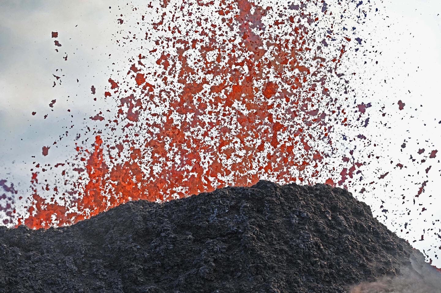 Lava spattering out of a cone 