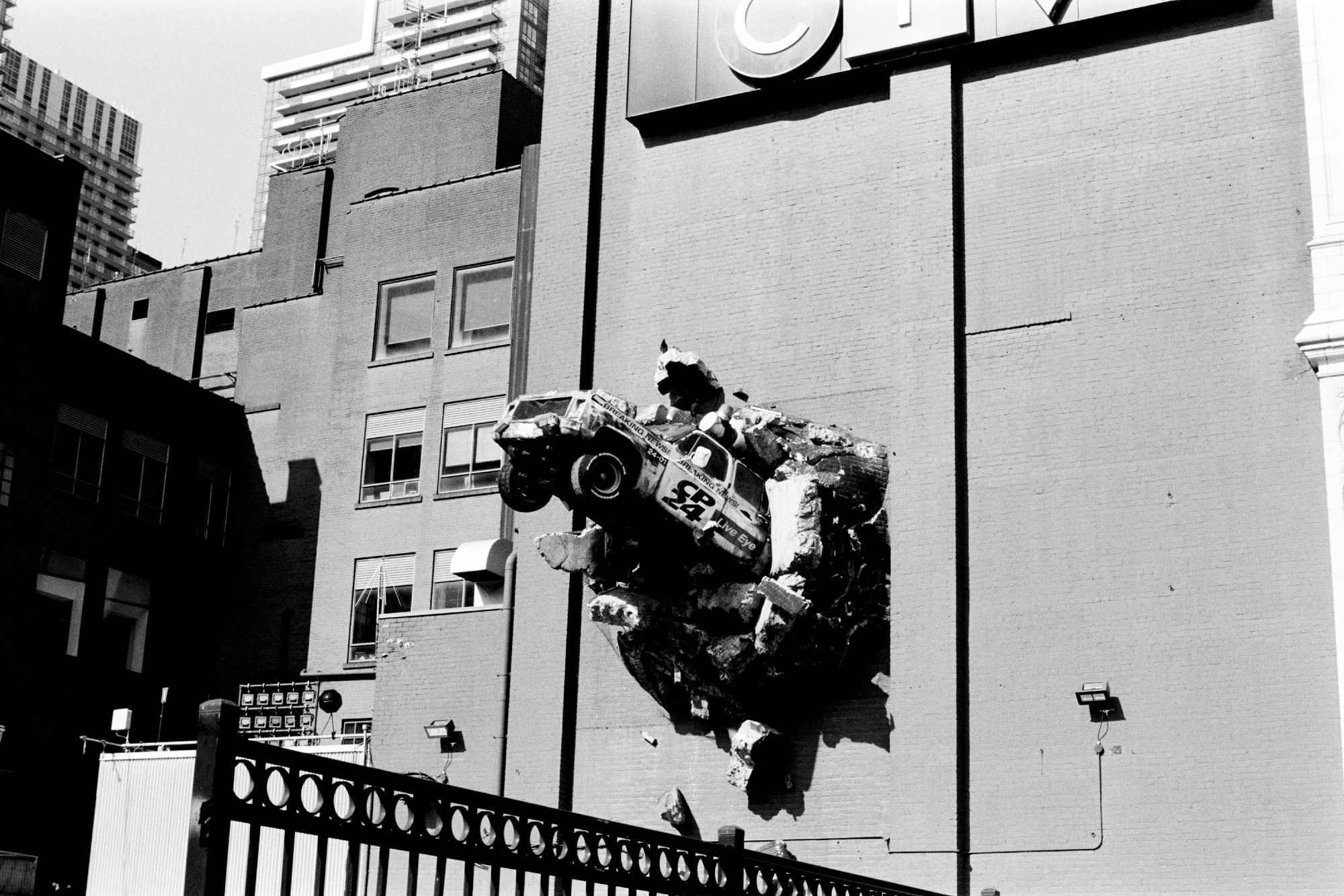 News gathering truck formerly labeled CityPulse (now CP24) bursting from the wall of a building. Well, that's what it's supposed to look like anyway. It was their actual first truck, but mounted in 1993 as promotion of the station instead of being scrapped.