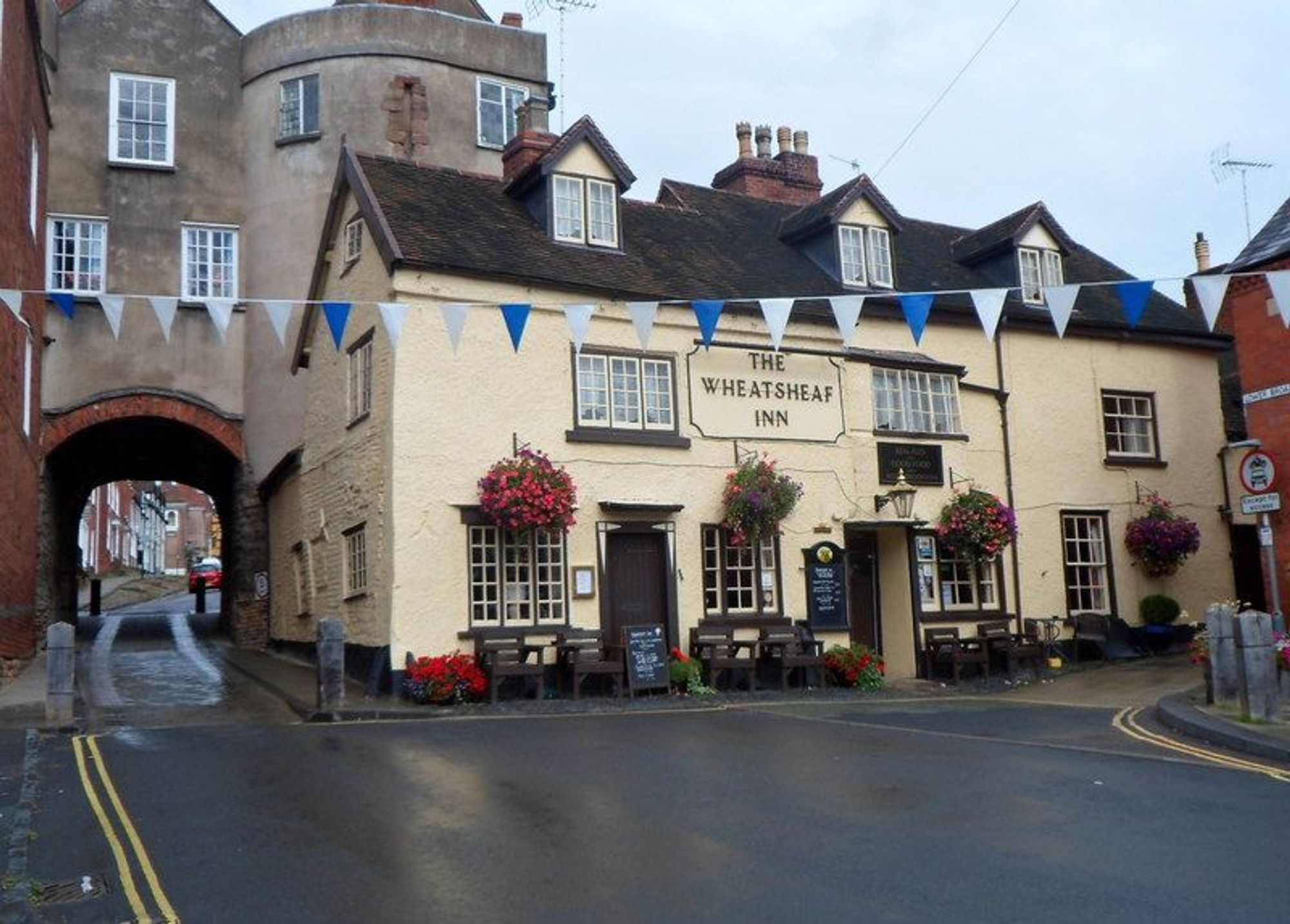 A photo of The Wheatsheaf Inn and The Broad Gate, Ludlow by Jaggery, via Wikimedia Commons