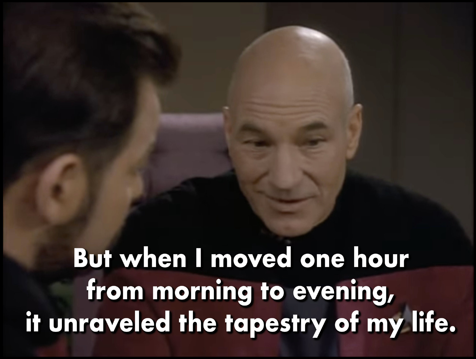 Still image from “Star Trek: The Next Generation”, season 6, episode 15, “Tapestry”. Captain Picard, seated at his desk, looks downward in self-reflection, with his mouth half-smiling. He says, “But when I moved one hour from morning to evening, it unraveled the tapestry of my life.”