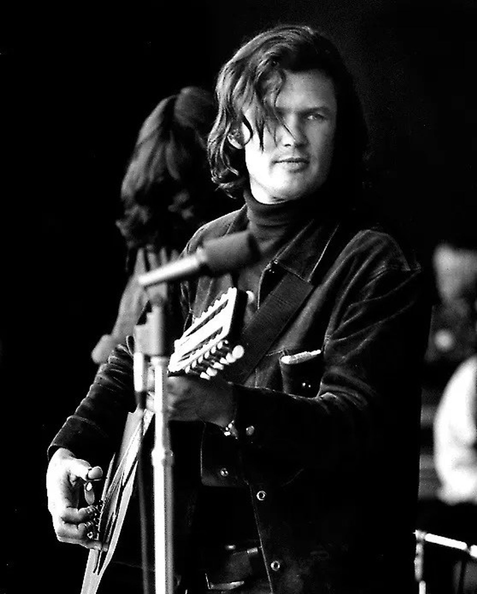 Portrait of the musician playing acoustic guitar